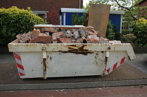 Various pieces of furniture being cleared from a home in Ruislip